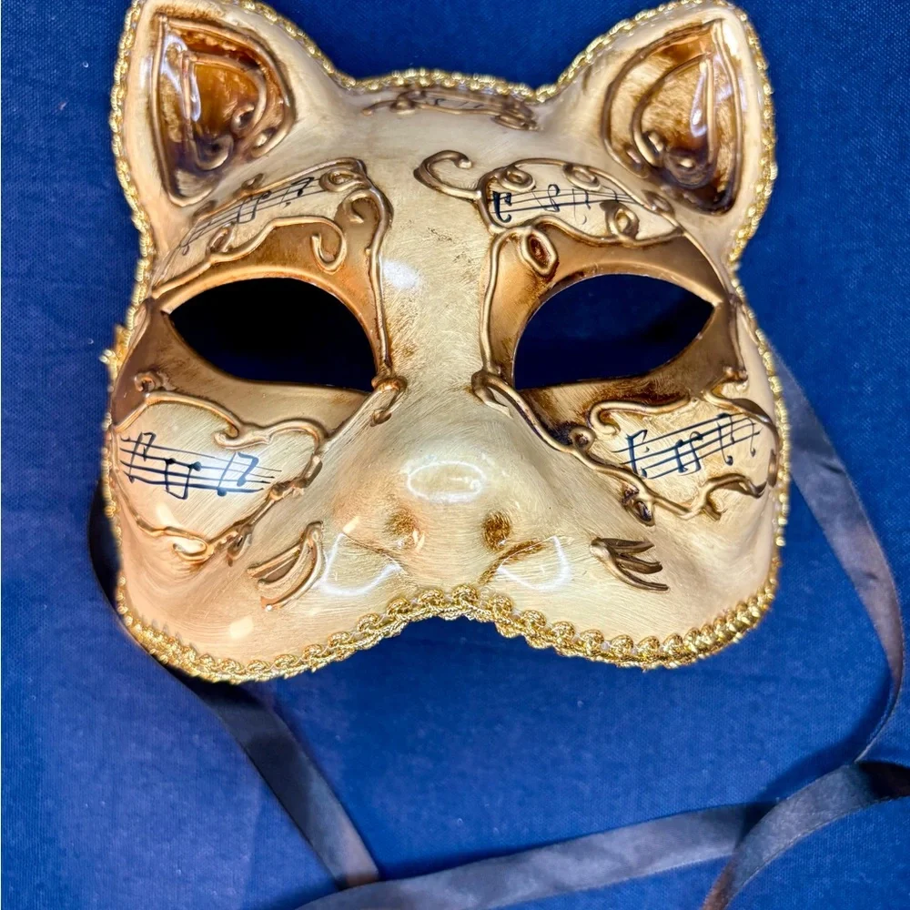 Elegant Gold Cat Mask with Musical Accents